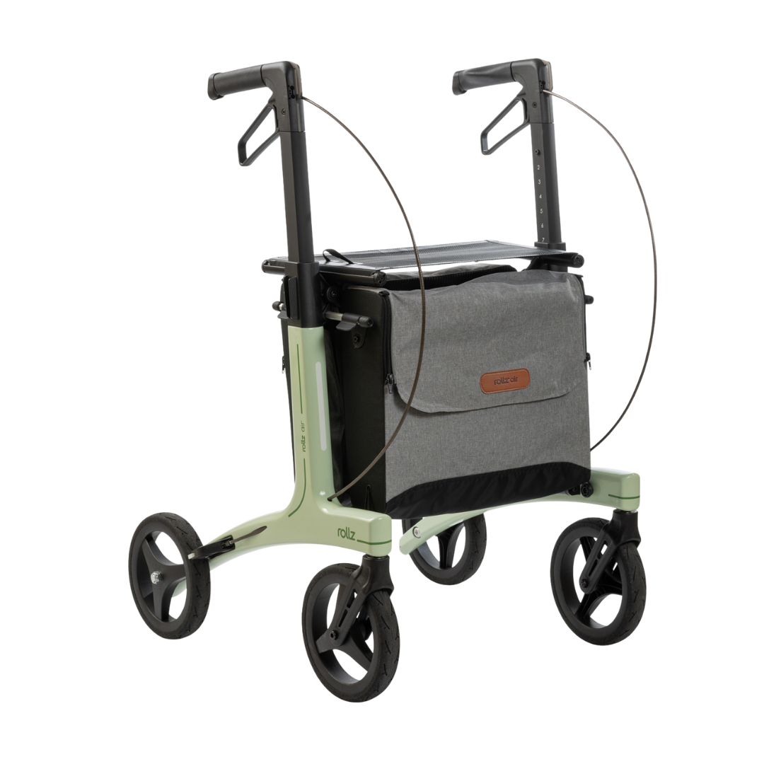 The Rollz Air Lightweight Folding Carbon Rollator weighs just 10.4 lbs and features ergonomic handles and a front gray storage bag, offering modern, stable mobility assistance.